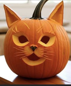 a carved pumpkin with a cat's face on it