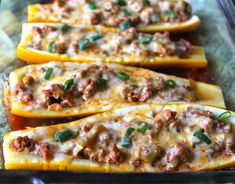 stuffed squash with meat and cheese in a baking dish