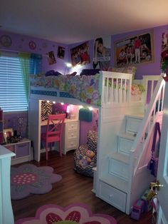 a child's bedroom with bunk bed, desk and stairs