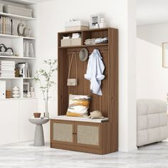 a white living room with an open bookcase