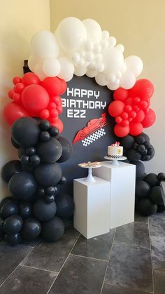 Black wooden backdrop with red, white and black balloon garland. Formula 1 themed signage. Formula 1 cake and sugar cookies. Race car sugar cookies, race car cake, formula 1 kids party ideas, formula 1 backdrop, paradise valley arizona, white cake stands, white pedestals Formula1 Cake Birthday, F1 Racing Birthday Theme, Formula 1 Balloon Decor, Forza Horizon Birthday Party Ideas, Honda Themed Birthday, F1 Birthday Party Ideas Mercedes, Formula One Theme Party, Red White And Black Balloon Arch, Decoracion Fiesta Red Bull F1