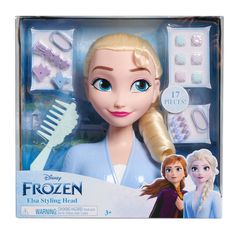 the frozen princess doll with her hair and makeup accessories in its package, including a brush