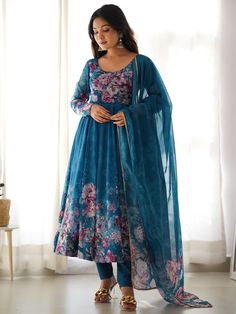 This beautiful blue color organza anarkali suit features intricate floral print work, making it a perfect choice for festivals, functions, and events. The set includes a matching cotton silk pant and a dupatta with floral print work and border gota patti lace work.
The anarkali suit has a 2.3-meter flair, and the dupatta is also 2.3-meters long.  This blue anarkali pantsuit include its fully stitched design, available in sizes XS to XXL, ensuring a perfect fit for everyone.
The vibrant blue Fresh Look Outfit, Organza Anarkali Dress, Lace Anarkali, Kali Pattern, Women Wedding Suit, Silk Anarkali, Gown With Dupatta, Costume Noir, Organza Gowns