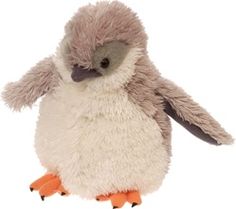 a small stuffed penguin sitting on top of a white floor next to the words click to enlarge