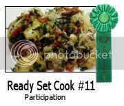 the ready set cook 11 participant badge is in front of a plate with food on it