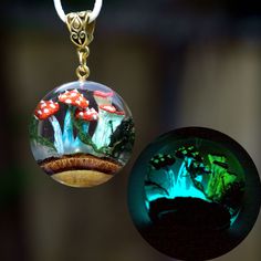 "Mushroom crystal Pendant necklace. Glow in the dark Crystal terrarium necklace. Gift for women. ♥ This item is handmade, so each piece is unique. The piece you receive will be based on this design and very similar to photos. ♥♥ Please see the current discounts in the shop announcement: https://www.etsy.com/shop/TSMDecorations Handmade from natural wood and clear art resin. Real mushrooms and moss were sealed in resin  along with an interesting piece of wood with bark.  Mushrooms are painted lik Mystical Clear Jewelry For Gifts, Mystical Resin Necklaces For Gifts, Handmade Fantasy Crystal Necklace For Gifts, Green Mushroom Design Jewelry Gift, Handmade Mystical Resin Jewelry, Mystical Luminous Jewelry Gift, Mystical Luminous Jewelry For Gifts, Whimsical Resin Necklaces For Gifts, Whimsical Resin Necklace For Gifts