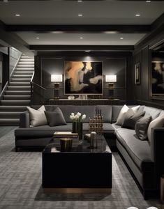 a living room filled with lots of furniture next to a stair case in front of a painting