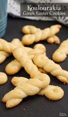 some cookies that are sitting on a black surface with the words koluuraka greek easter cookies