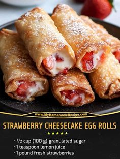 strawberry cheesecake egg rolls on a black plate