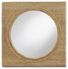 a round mirror with rope around it