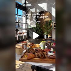 a table topped with croissants and other pastries