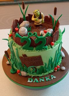 there is a cake decorated with plants and animals