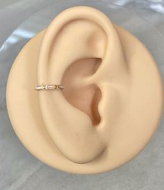 a fake ear with a ring on top of it