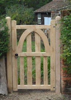 a wooden gate with an arched top