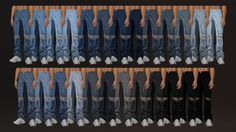 several pairs of jeans hanging on a rack in front of a black background with white shoes