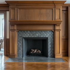 a fireplace in a large room with wood paneling