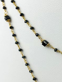 Black diamond rosary necklace with cube diamond accents. Necklace is 14k yellow gold. Round black diamonds range from 22mm - 2.3mm and cubes are 2.7-3mm on each side. metal - 14k Yellow Gold Diamonds - 15cts (estimated) Length - 37" Diamond Rosary, Rosary Necklace, Black Diamonds, Rosary, Black Diamond, Gold Diamond, Diamonds, Yellow Gold, Range