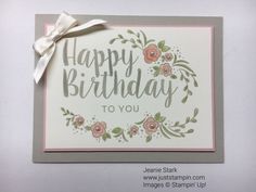 a happy birthday to you card with flowers and ribbon on the front, sitting on top of a table