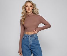 Keep it casual and chic with a crop top that is essential to your layered outfits! The top features a turtle neck. long sleeves. and a cropped hem. The top is composed of a ribbed knit fabric that offers a form hugging fit with a moderate stretch. Complete look with mom jeans and a plaid coat.Fit & Features Turtle neck Long sleeves Cropped hem Ribbed knit fabric Form hugging fit. moderate stretch Runs true to size Layered Outfits, Mesh Party Dress, Black Long Sleeve Crop Top, Homecoming Outfits, Sequin Rompers, Plaid Coat, With Mom, A Turtle, Layering Outfits