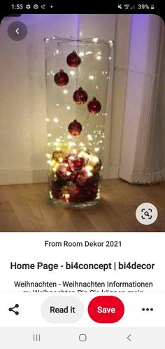 a vase filled with christmas ornaments on top of a wooden floor