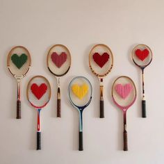 six different types of tennis rackets with hearts on them