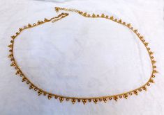 * Beautifully designed gold color belly chain. * can be used with belly dance costumes and saris. * Adjustable from 25 to 41 inches waist. * D.no.1 * D.no.2 *D.no.3 *D.no.4 Bohemian Gold Waist Chain For Festivals, Bollywood Gold Bridal Belt For Festivals, Gold Bollywood Bridal Belt For Party, Gold Bridal Belt For Diwali Ceremonial, Gold Beads Choker For Festival, Gold Bollywood Waist Chain For Festivals, Bollywood Style Waist Chain With Tilla For Festive Occasions, Gold Bollywood Waist Chain For Wedding, Gold Bohemian Choker With Tilla Detail