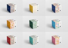 six boxes with different designs on them, all in different colors and patterns are shown