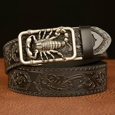 With its delicate buckle depicting a scorpion, symbolizing protection and dynamism, the Esprit Animal Walker belt embodies quiet strength and determination. It captivates the imagination and is an accessory for the fearless individual with a strong personality who knows how to face adversity with elegance. Luxury Leather Men's Belt Buckles, Scorpion Pattern, Cool Belt, Western Leather, Jeans Casual, Unique Bags, Brown Belt, Genuine Leather Belt, Watch Collection