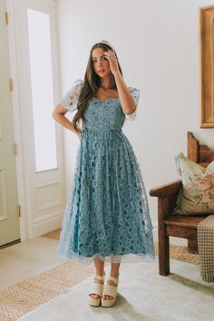 Elevate your style with our EXCLUSIVE Seaside Brunch Dress. In a beautiful dusty blue, our midi dress features a delicate floral eyelet overlay and a double tie for a touch of elegance. The square neck adds a unique touch to this one-of-a-kind design, exclusively available at One Loved Babe. Available in sizes XS-6XL for all to enjoy. Details Midi length Sheer sleeves Lined Invisible zipper enclosure Double tie Square neck Floral eyelet overlay Sizing *Measurements are taken with item hanging an Blueberry Dress, Nursing Friendly Dress, Plus Size Wedding Guest Dresses, Plus Jumpsuit, Brunch Dress, Exclusive Dress, Basic Dress, Plus Size Wedding, Knee Length Dresses