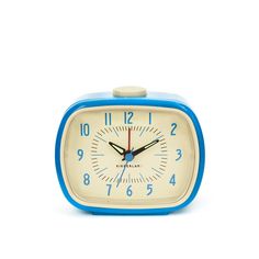 a small blue and white alarm clock on a white background with the words kakablaand written below it