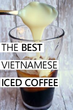 the best vietnamese iced coffee is in a glass with liquid pouring from a spoon into it