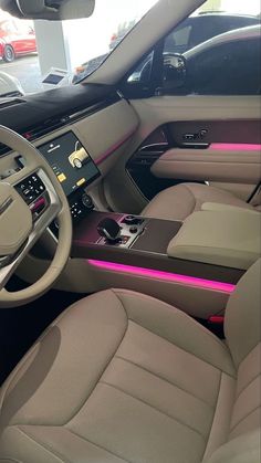 the interior of a car with pink trim