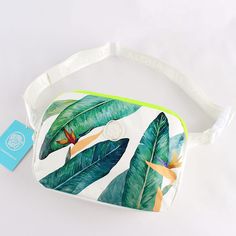 Infuse your daily adventures with the exotic charm of the Hawaiian islands using our Hawaiian Bird of Paradise Hip Pack. Featuring the stunning and symbolic bird of paradise flowers, this hip pack is not just a functional accessory but a bold statement of style inspired by the lush beauty of Hawaii. ◾️Features◾️ Dimensions (8.5 x 6 x 2 inches): Compact and convenient size for all your essentials. Easy Maintenance: Wipe down with a soft damp cloth or hand wash. Flat to dry, ensuring the longevity and vibrant appearance of the bag. Secure Two-Way Zip Closure: Easy access to your belongings, allowing for quick retrieval. Thoughtful Interior Organization: Two interior zip pockets keep your valuables secure and organized. Exterior Zip Pocket: Additional storage for easy access to essentials on Tropical Green Shoulder Bag For Travel, Paradise Flowers, Interior Organization, Explore City, Hip Pack, Bird Of Paradise, Hawaiian Islands, Functional Accessories, Birds Of Paradise