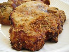 three fried meat patties on a white plate