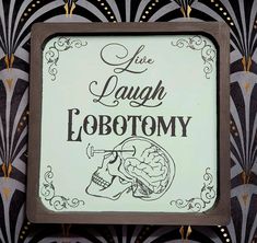 a sign that says live laugh lobotomy on the side of a building