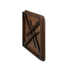 a wooden wall hanging with two metal bars on it's center and an x design in the middle