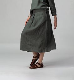 READY TO SHIP - FOLD is a basic midi linen skirt, with a chic front pleat detail that drapes beautifully.  The subtle A-line silhouette creates a soft, relaxed and feminine look. It features a concealed back zipper to create a more fitted look. It is easily complemented by the top of your choice. The concealed side pockets make it easy to wear with platforms, flat sandals and trainers. Made of quality stonewashed European linen, softened and wrinkled to perfection. FIT The Front Pleat Skirt has Spring Linen Pleated Bottoms, Spring Pleated Linen Bottoms, Solid Color Linen Flared Skirt, Chic Linen Fall Skirt, Casual Linen Skirt For Fall, Linen A-line Skirt For Workwear, Chic Linen Pleated Skirt, A-line Linen Skirt For Work, Flowy Linen Skirt For Workwear