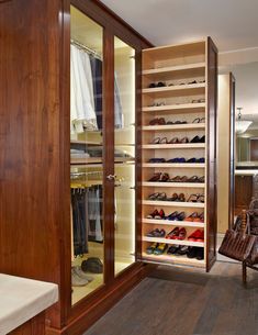 the closet is filled with many pairs of shoes