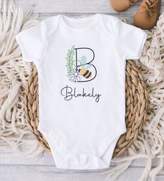 ** Quick Sizing Tip ** Baby ONESIES® Brand Bodysuits tend to run very small so we recommend sizing up for a better fit and to give baby longer wear time because they grow so fast. Toddler shirts are true to size. 📋 HOW TO ORDER: ✧ Choose Baby ONESIES® Brand Bodysuit or shirt size (sizing chart below) and sleeve length ✧ Select design color if applicable ✧ For personalized designs - enter customization in "Add your personalization" field ✧ ADD TO CART ✧ Select from our shipping class options (al Playful Cotton Onesie With Custom Print, Personalized Cotton Onesie For Playtime, Personalized Cotton Playtime Onesie, Playtime Cotton Bodysuit With Name Print, Cotton Bodysuit With Name Print For Playtime, Gerber Organic, Personalized Baby Onesies, Personalized Baby Girl