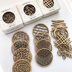 several pieces of laser cut wood sitting next to each other on a white counter top