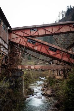 an old rusty bridge over a small stream