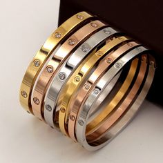 18k Gold Plated over Stainless Steel Great addition to your jewelry collection. Bracelet Cartier, Lovers Bracelet, Bangles Gold, Trending Bracelets, Cubic Zirconia Bracelet, The Bangles, Real Gold Jewelry, Bracelet Love, Buckle Bracelet