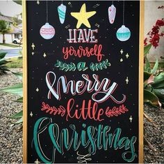 a chalkboard sign that says have yourself merry little christmas