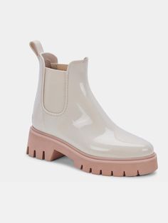 The Stormy Rainboots are ready for whatever rainy weather you can throw at them - all without losing style points. This light-colored rain bootie pairs perfectly with leggings, skinny jeans, or your favorite mini skirt. DETAILS 90% plastic + 10% textile upper Rubber outsole Synthetic sock Fabric lining 9.6" leg circumference 1.3" heel height BRAND Dolce Vita Rain Boots Women, Chelsea Rain Boots, Boots White, Rain Or Shine, Rain Boot, Dolce Vita Shoes, Shoes Booties, Waterproof Boots, Lug Sole