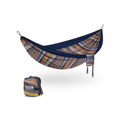 a blue and yellow hammock sitting next to a bag