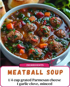 a bowl of meatball soup with carrots, spinach and bread on the side