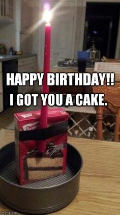 a birthday cake sitting on top of a pan in the middle of a kitchen table