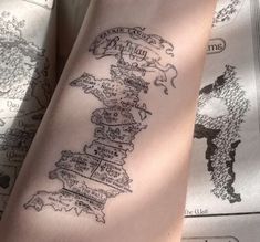 a person with a map tattoo on their arm