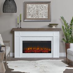 a living room with a fire place in the center and a rug on the floor