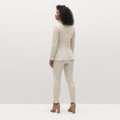 Keep it cool in the women’s tan suit. Meticulously tailored with comfortable drape, our luxurious light beige suit plays up a classic look. Perennially on-trend, this delicate camel pantsuit is constructed with Eco Stretch fabric for a breezy feel and a look that moves with you. Elegant Tailored Cream Tweed Jacket, Classic Beige Pantsuit For Work, Elegant Cream Single Breasted Tweed Jacket, Business Casual Beige Blazer With Pressed Crease, Elegant Cream Tweed Jacket Single Breasted, Elegant Beige Suits For Office, Elegant Fitted Beige Tweed Jacket, Chic Fitted Tweed Jacket For Office, Elegant Cream Single-breasted Tweed Jacket